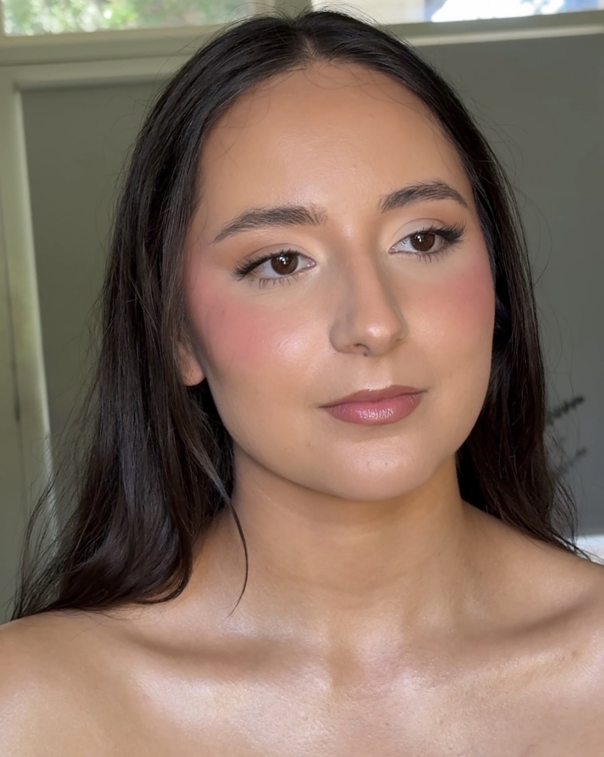 Fresh blush and defined lashes for an event makeup look