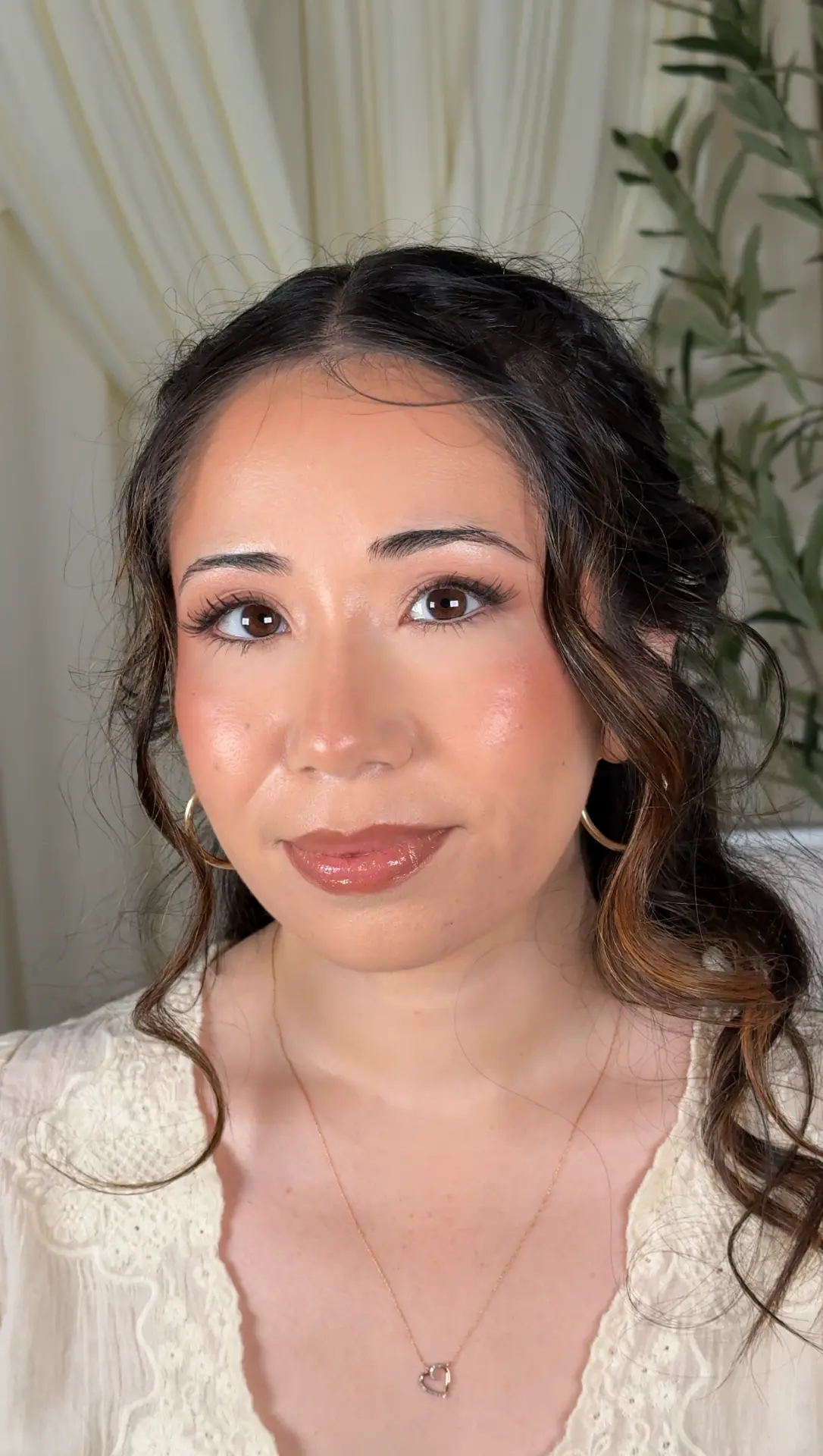 Warm champagne eyeshadow and glossy brown lip in an editorial portrait